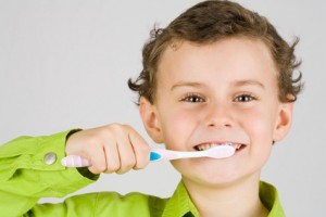 brushing teeth with homemade toothpaste